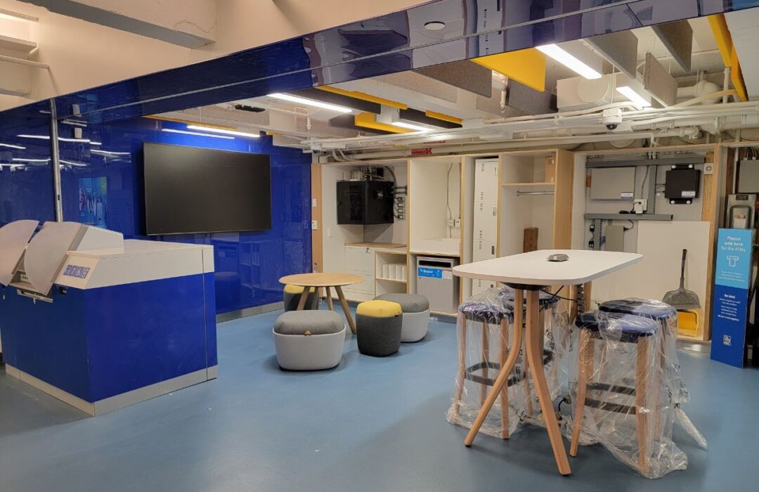 Renovated facility with blue walls and shared workstations